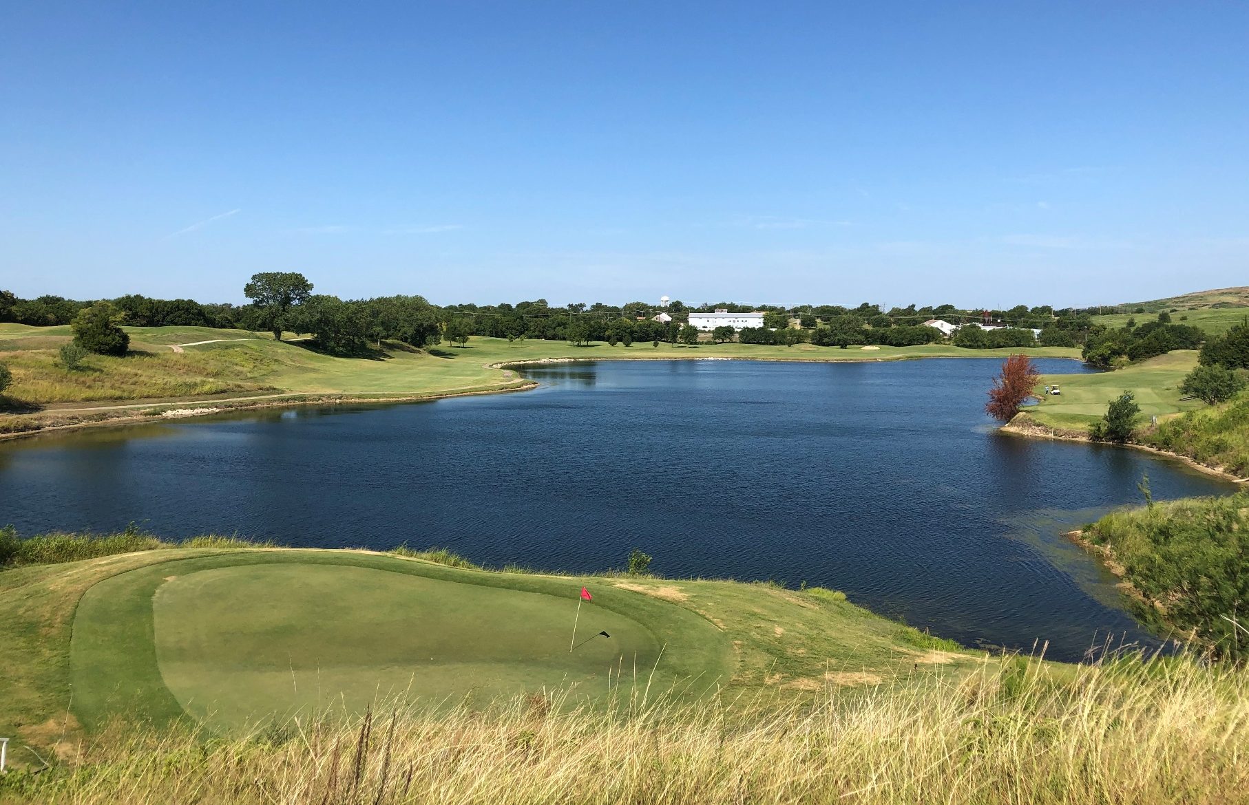 Old Brickyard Golf Course with water hazard and green in foreground